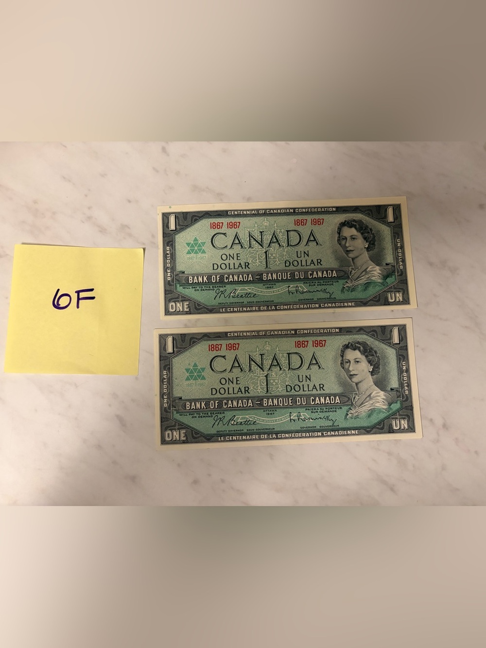 1967 set of 2 - Canada Centennial One Dollar Bills - Green - uncirculated